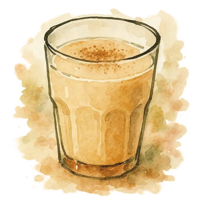 A watercolour of a glass of pale milky spiced tea with a faint dusting of cinnamon